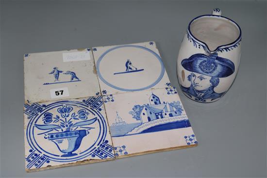A faience jug and four Delft tiles